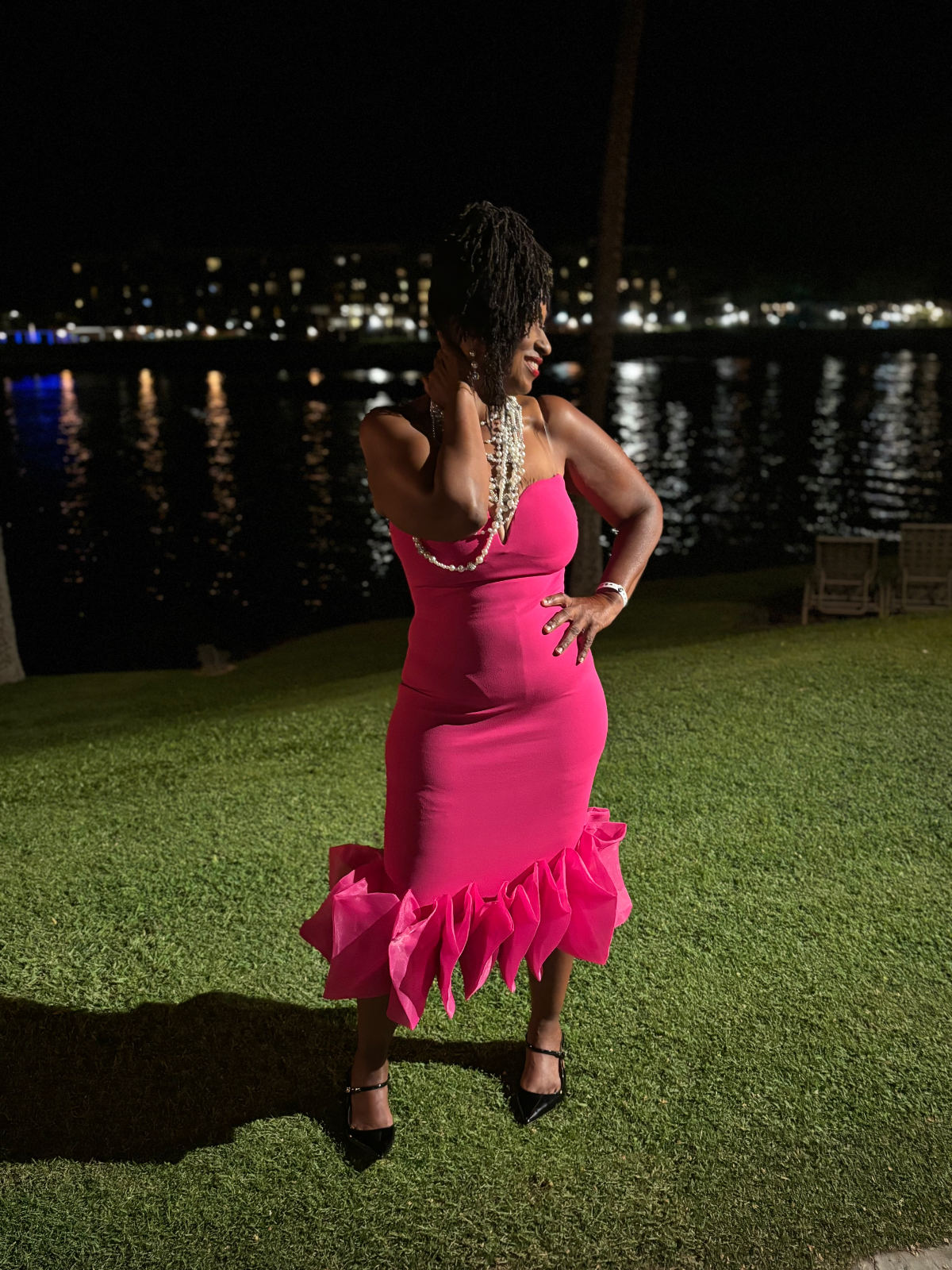 Tammy Johnson in a pink dress enjoying an elegant evening outdoors