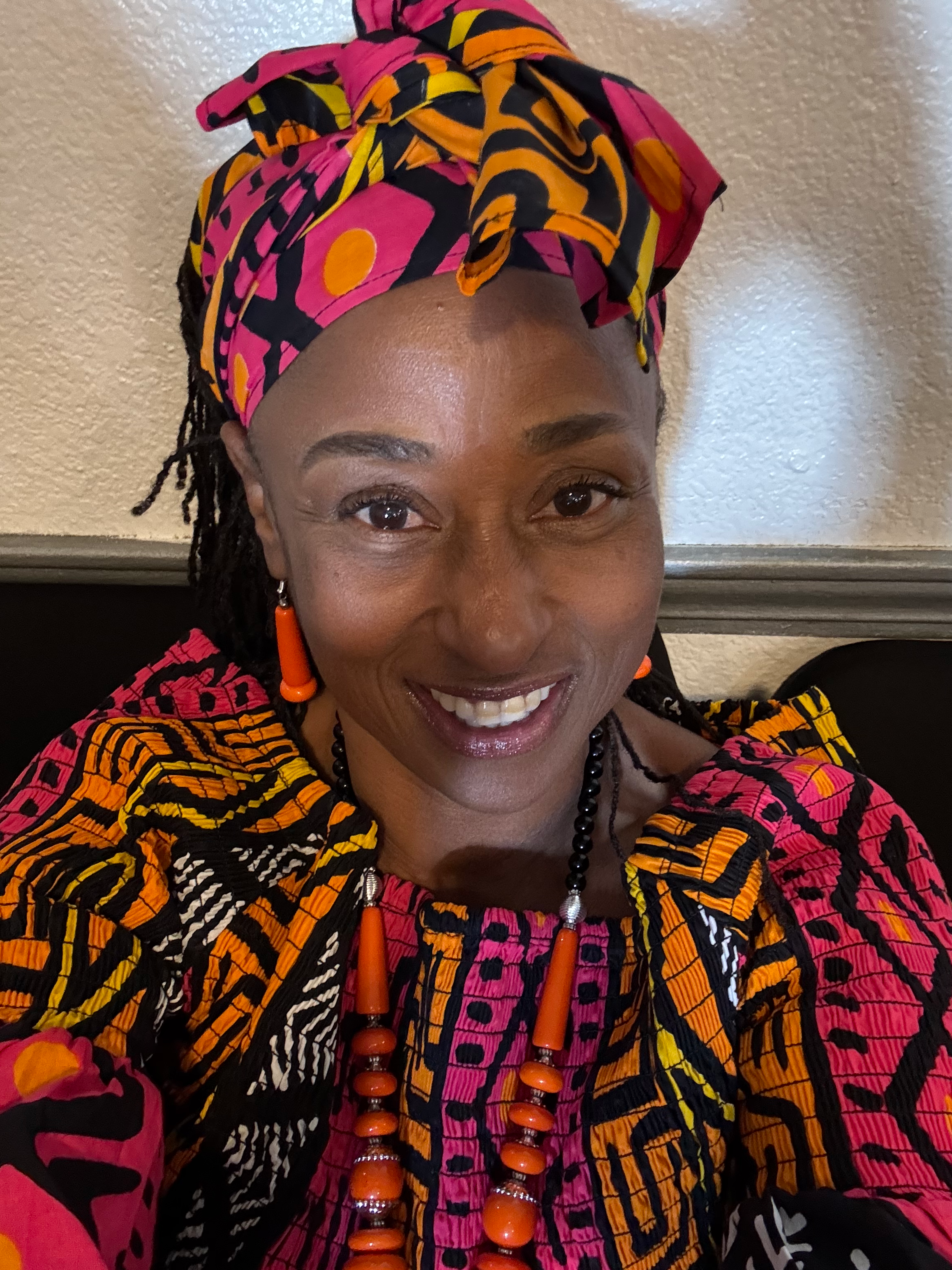 Tammy Smith in a stylish pink dress by the water